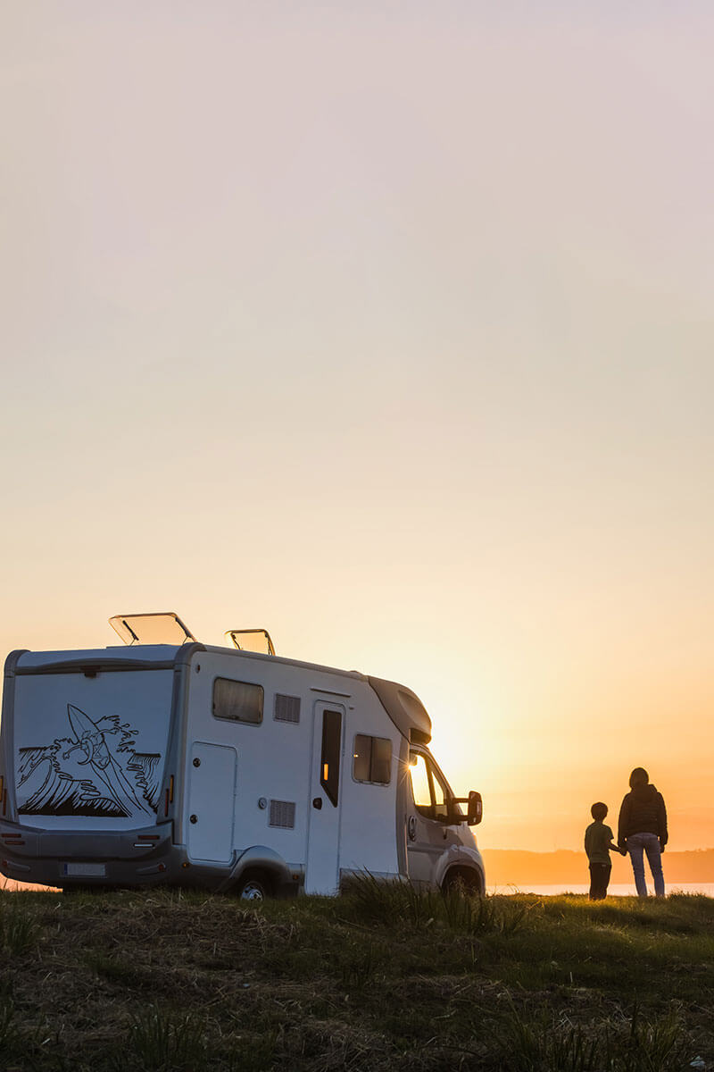 RV parked during a sunset