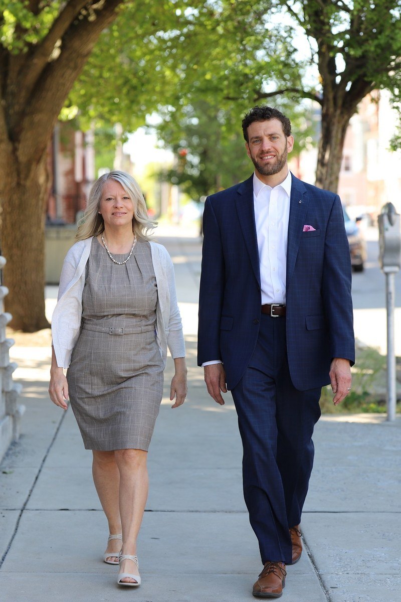 TGA Agents, Dana and Roeg, walking together in a park