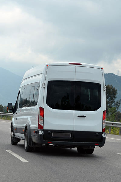 Company van traveling on a highway