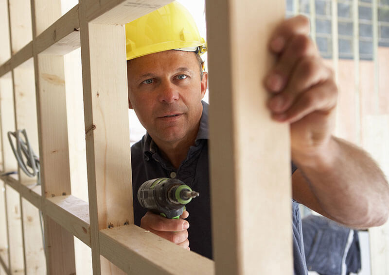 Construction worker inspecting project