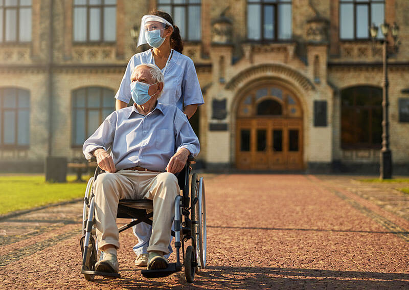 Patient and doctor outside of medical building