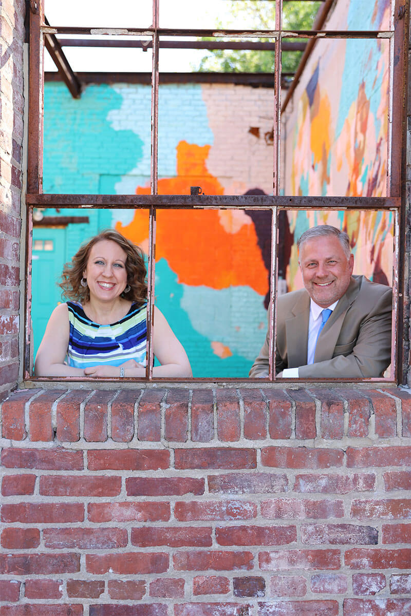 TGA Agents posing in a brick window