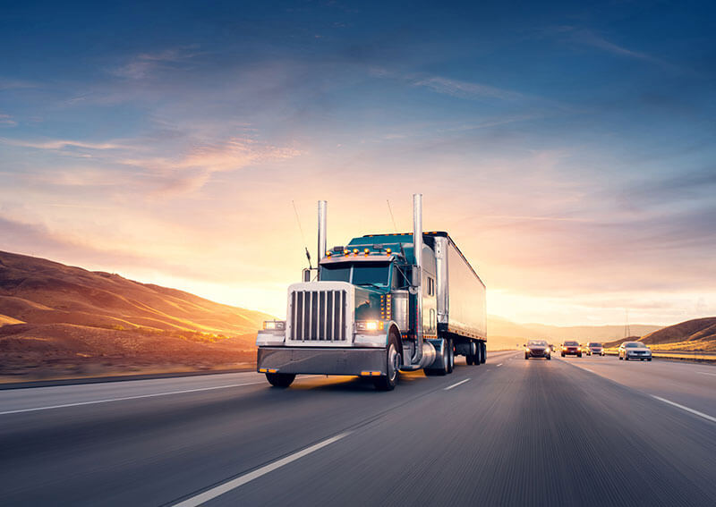 Tractor trailers driving down highway