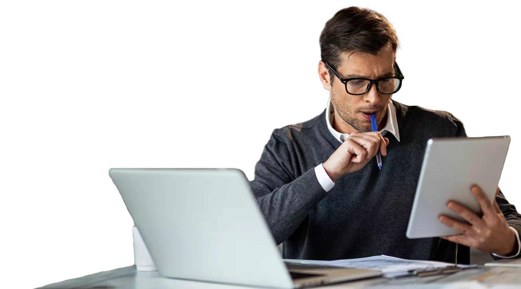 Man wearing glasses working at a computer
