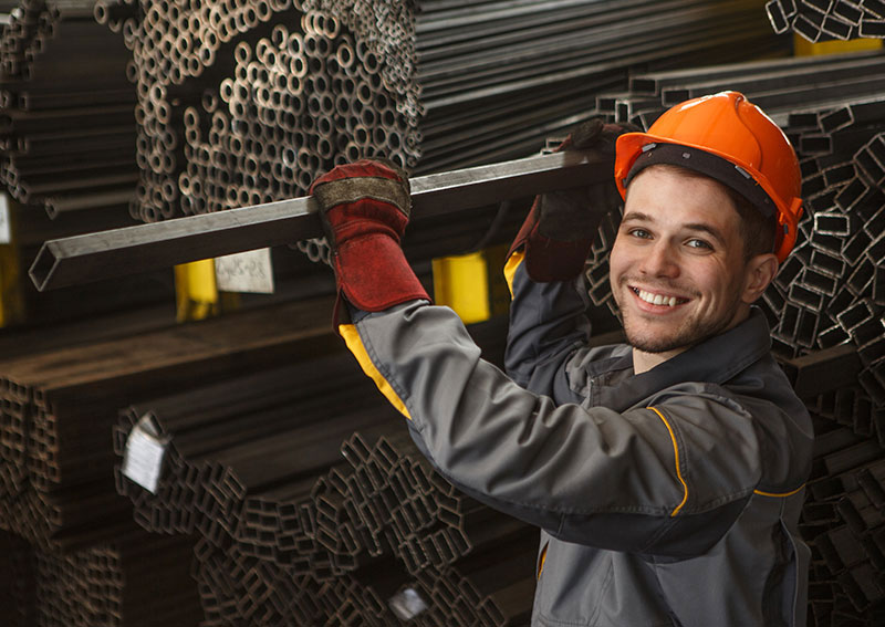 Manufacturing employee smiling