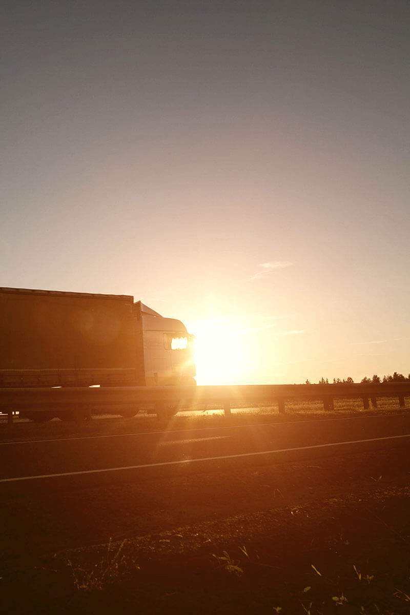 Tractor trailers driving down highway