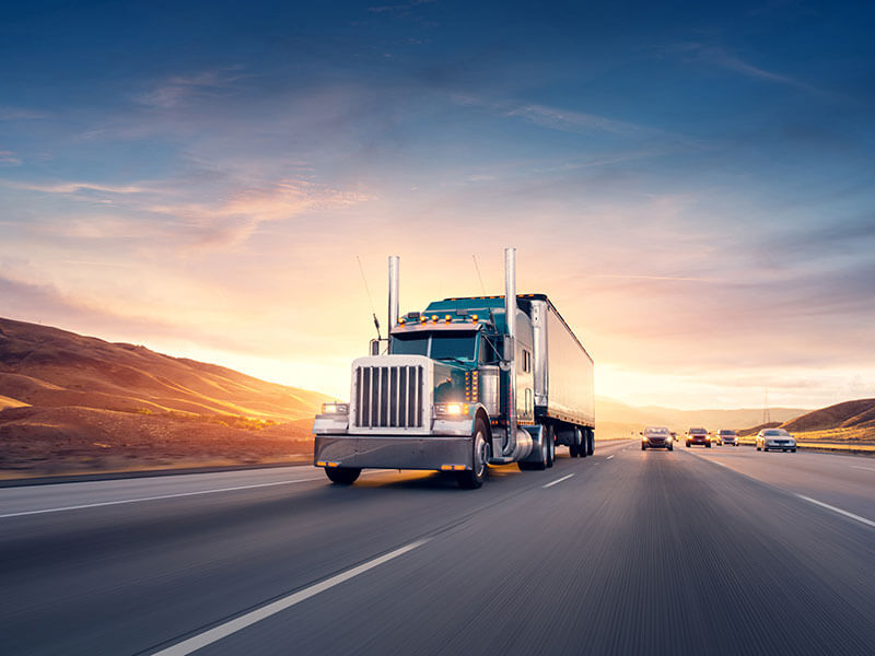 Tractor trailers driving down highway